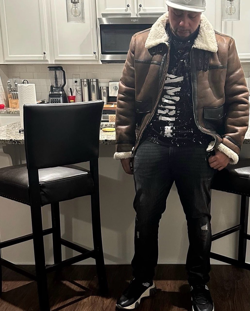 Tmac in a brown jacket